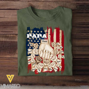 Personalized Papa US Flag Background Hands With Kid Name Printed Tshirts 23APR-BQT20