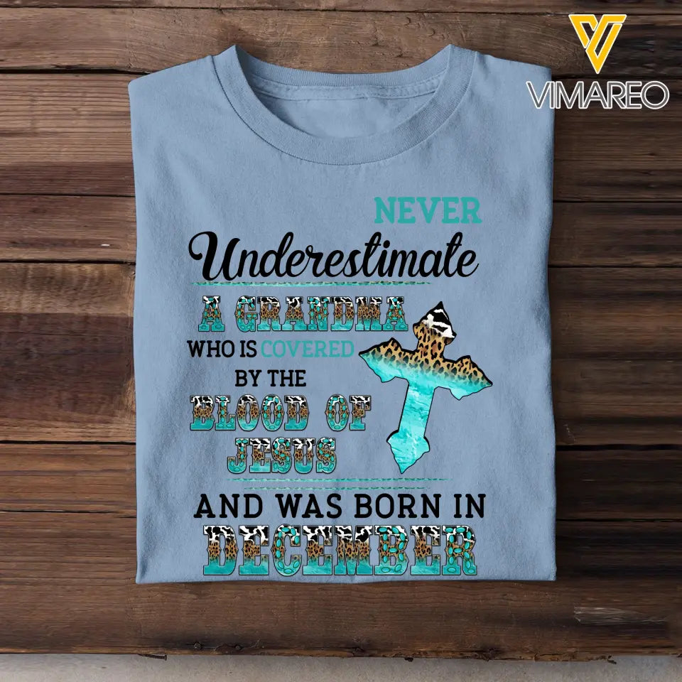 Personalized Never Underestimate A Grandma Who Is Covered By The Blood Of Jesus And Was Born In December Tshirt LDMVQ23409